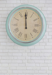 vintage old clock on white brick wall, horizontal.