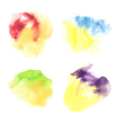 Set of four bright yellow colorful stains painted in watercolor on clean white background