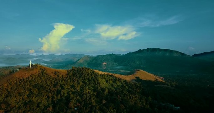 Aerial - drone flying over the hill with a cross. Mt Tapyas in Coron, Palawan, Philippines.