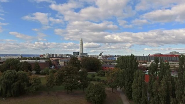 Landing in a park with turning torso in the background.