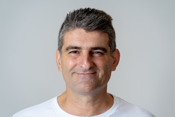 Fototapeta premium Close up portrait of a smiling and laughing mature man in happy face human emotions and expressions