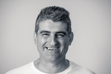 Fototapeta premium Close up portrait of a smiling and laughing mature man in happy face human emotions and expressions