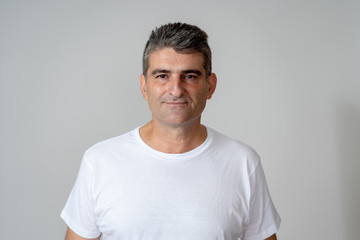 Close up portrait of a middle age man in neutral poker facial expressions and human emotions