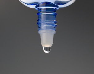Eyedrop in blue transparent container.