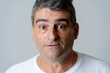 Obraz premium Concern scared shocked adult man with a terrified facial expression