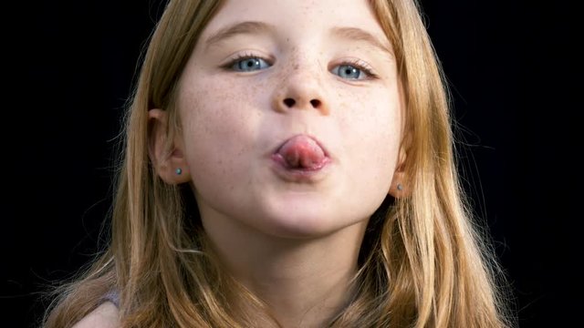 Young girl being silly and sticking her tongue out