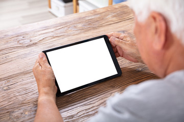 Senior Man Using Digital Tablet