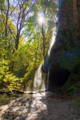 Fototapeta na wymiar Beautiful waterfall in the park.