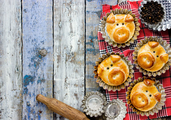 Pig bread buns, funny baking idea shaped cute piggy faces, symbolic food for new year 2019