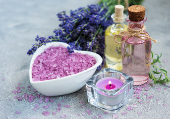 Fototapeta na wymiar Heart-shaped bowl with sea salt and fresh lavender flowers