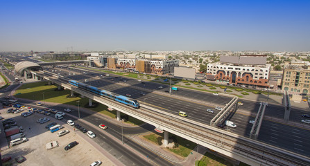 Fototapeta na wymiar Dubai city street or road full of cars and metro. United Arab Emirates