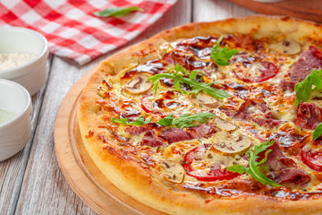 Delicious fresh pizza served on wooden table