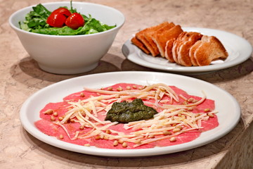 carpaccio with salad and toast