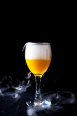 Glass with white fog at dark background