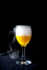 Glass with white fog at dark background