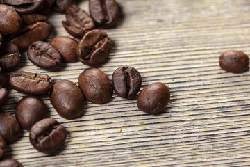 Coffee beans on wood background