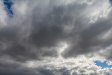 The sky covered with gray, heavy clouds.