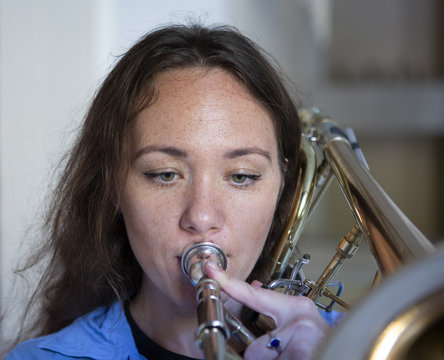 Teenage Girl Playing The Trombone