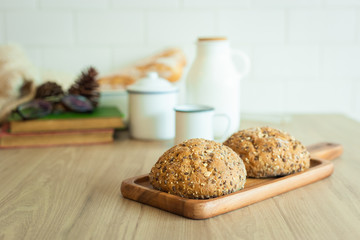 composition of bread with dish wooden on wood table.