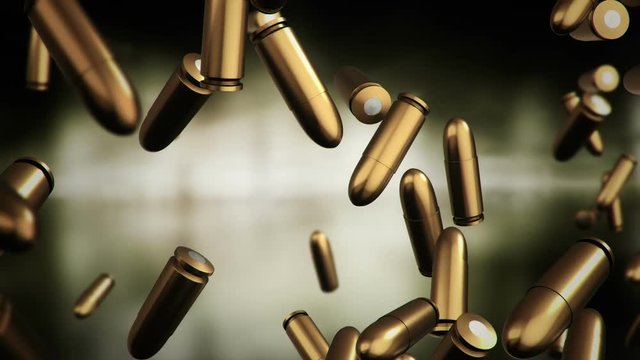 Animation falling of bullets different calibers on dark and blurred background. Animation of seamless loop.