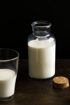 Bottle of milk placed on a wooden table