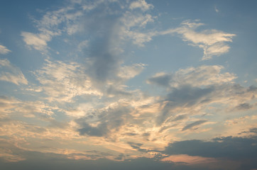 Yellow evening sunset in the sky with clouds