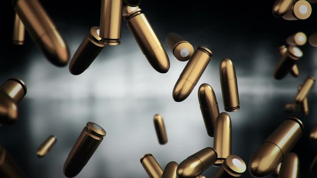 Animation falling of bullets different calibers on dark and blurred background. Animation of seamless loop.