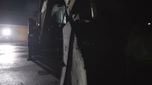 Backhoe is lifting arm