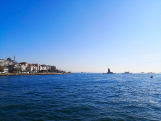 The Bosphorus Strait in Istanbul, Turkey-March 30, 2018: The Bosphorus Strait, adjacent to the Marmara sea, has the Maiden's tower or Leander's Tower on an islet off  the Asiatic shore.