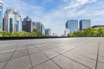 Panoramic skyline and modern business office buildings with empty road,empty concrete square floor