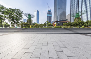 Fototapeta premium Panoramic skyline and modern business office buildings with empty road,empty concrete square floor
