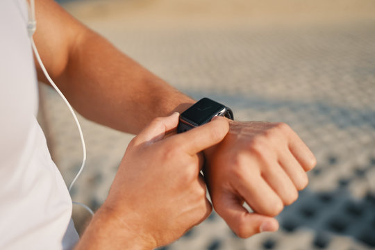 Person using smart watch close-up hands