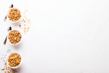 Granola Cereal bar  on light Background . Muesli Breakfast. Healthy Food sweet dessert snack. Diet Nutrition Concept. Vegetarian food. Flat Lay. Copy space