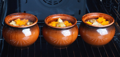 Traditional rustic home vegetable  ragout in three clay pots