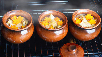 Traditional rustic home vegetable  ragout in three clay pots