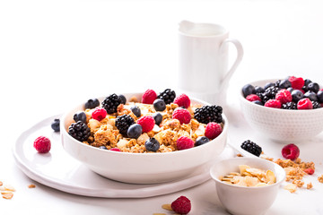 Granola Cereal bar with Strawberries blueberries and Milk on light Background . Muesli Breakfast. Healthy Food sweet dessert snack. Diet Nutrition Concept. Vegetarian food. Copy space for Text.