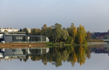 Fototapeta na wymiar Reflection of trees on lake in autumn
