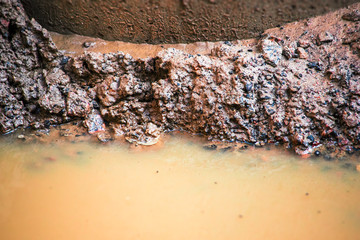 Dirt at the bottom of a flooded ravine
