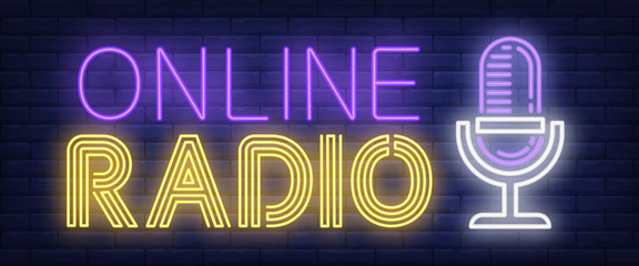 Online radio neon sign. Microphone on brick wall background. Vector illustration in neon style for radio station and broadcasting