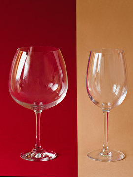 wine glasses on the paper beige and burgundy colors lines background