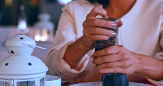 Woman using papper in restaurant