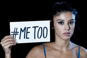 Portrait of young woman holding a note with the text me too. Stop Sexual Harassment campaign