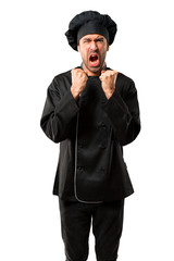 Chef man In black uniform annoyed angry in furious gesture. Frustrated by a bad situation on isolated white background