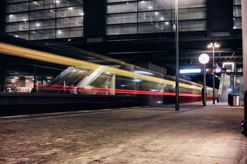 Fototapeta na wymiar Berlin Train Public Transport fast light time exposure reflexion east cross beer