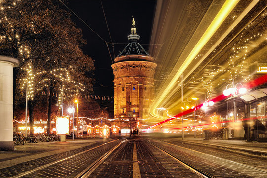 Time Exposure train traffic light night Mannheim street public transport christmas holiday shopping water tower people