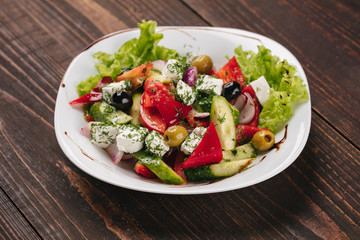 Greek salad on a white plate