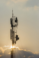 Telecommunication towers with colorful sky backgrounds at sunset