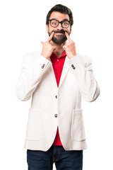 Happy brunette man with glasses on white background