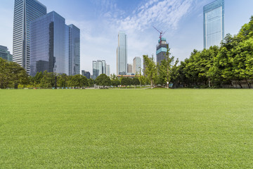 Obraz premium Panoramic skyline and modern business office buildings with empty road,empty concrete square floor