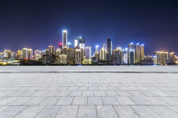 Obraz premium Panoramic skyline and modern business office buildings with empty road,empty concrete square floor